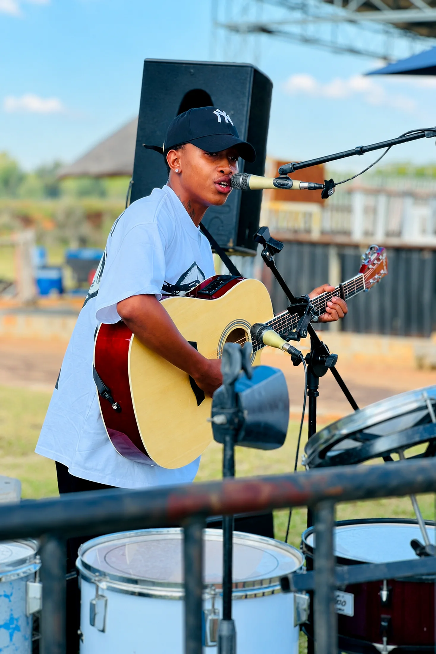 Outdoor performance with drum kit foreground