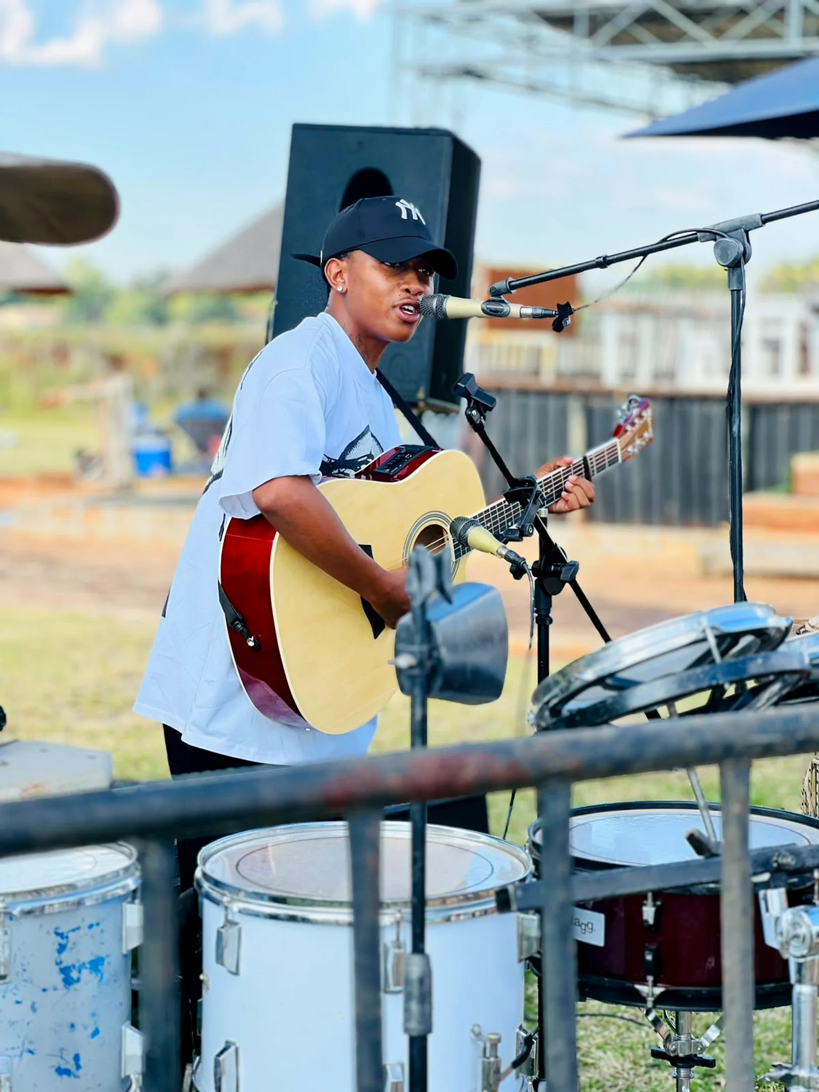 Original outdoor performance with drums foreground
